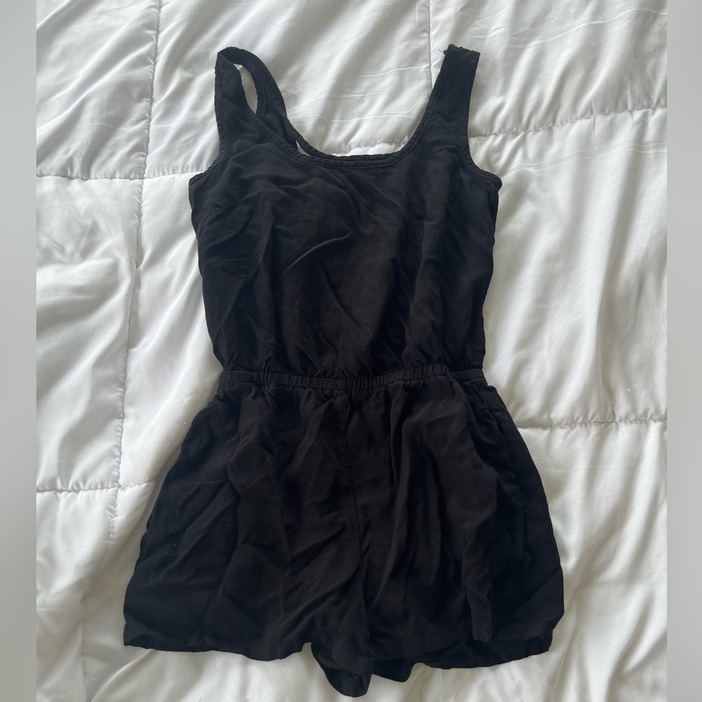 womens black one piece romper / jumper with open criss cross back